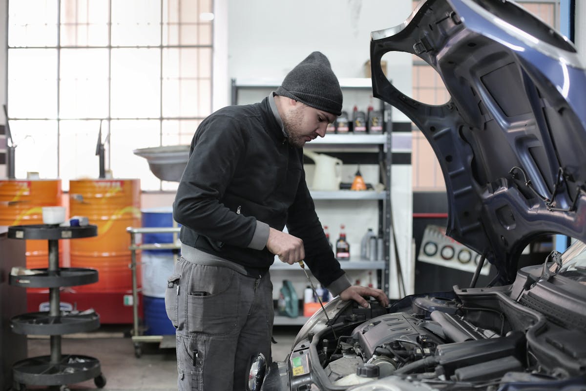 Tire technician working on vehicle