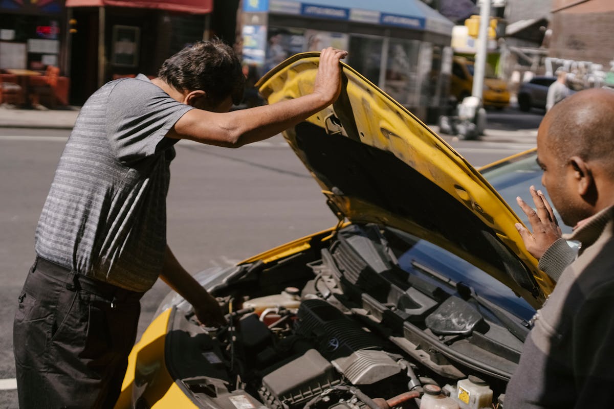 Mechanic inspecting a vehicle